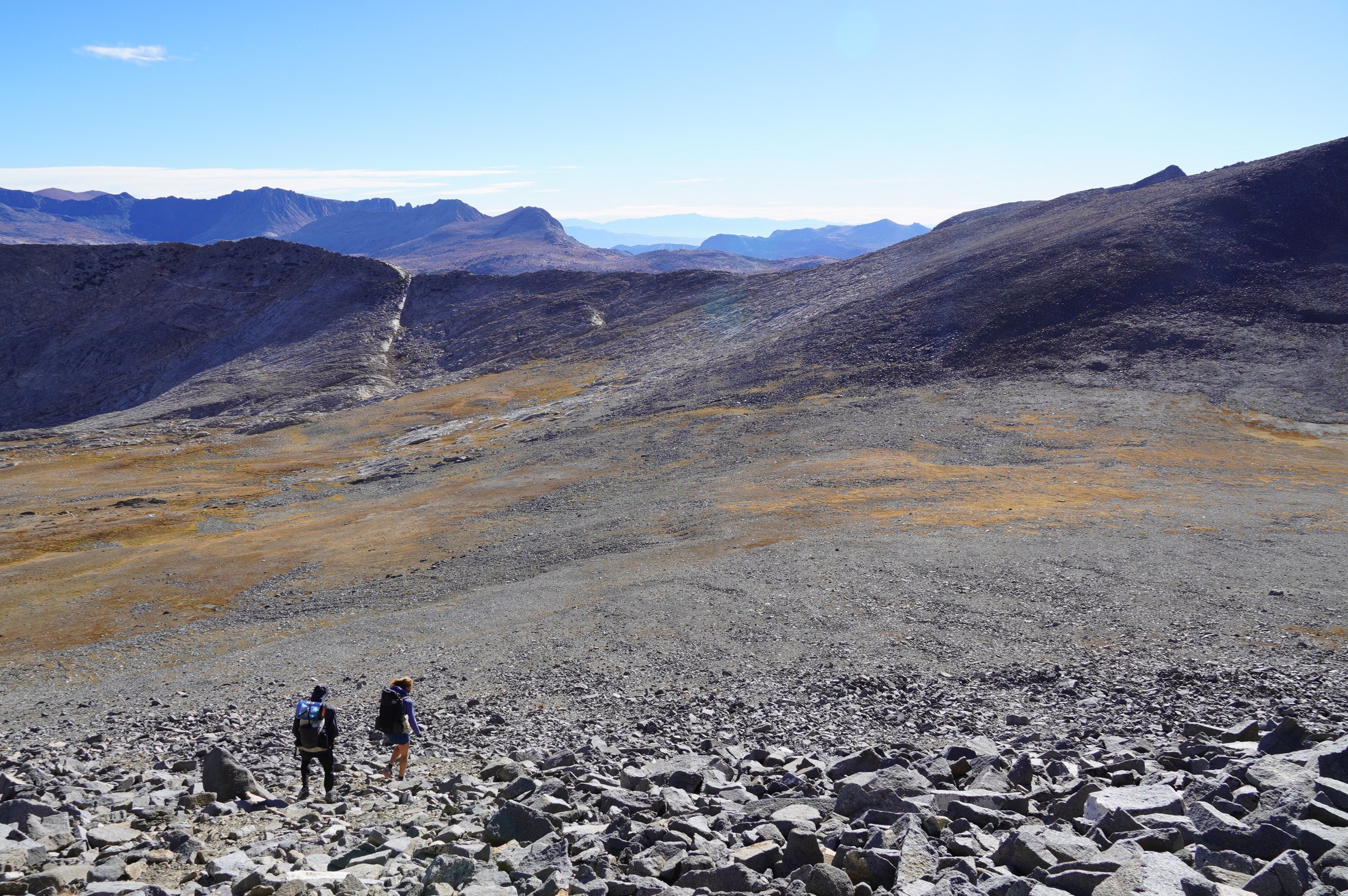 Descending across open rocky terrain